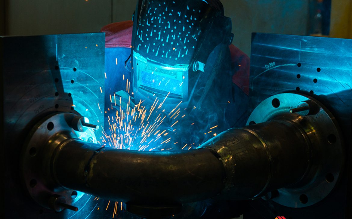 Welder working with steel